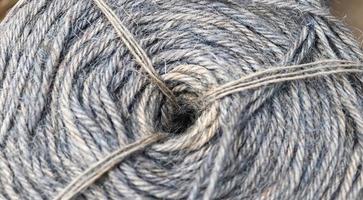Stranded threads. A tangle of yarn. Entangled confusing thread on a roll. photo