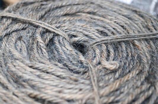 Stranded threads. A tangle of yarn. Entangled confusing thread on a roll. photo