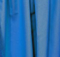 Detailed close up view on samples of cloth and fabrics in different colors found at a fabrics market photo