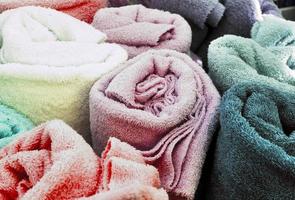 Detailed close up view on samples of cloth and fabrics in different colors found at a fabrics market photo