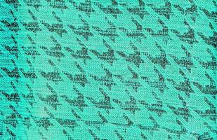 Detailed close up view on samples of cloth and fabrics in different colors found at a fabrics market photo