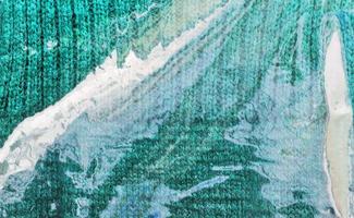 Detailed close up view on samples of cloth and fabrics in different colors found at a fabrics market photo