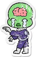 distressed sticker of a cartoon big brain alien crying and pointing vector