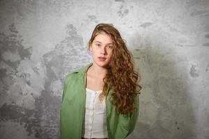 Pretty female looking at camera. Studio shot of beautiful woman. photo