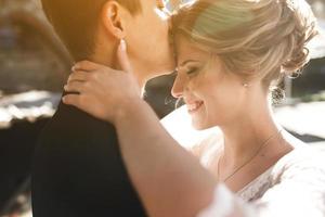 bride and groom posing on the streets photo