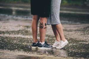 couple on the background of wet asphalt photo