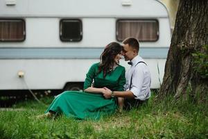 man and woman under a tree photo