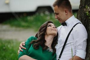 man and woman under a tree photo