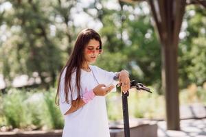 Young beautiful woman looks surprised in the park photo