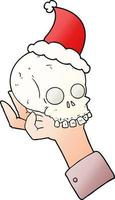 gradient cartoon of a hand holding skull wearing santa hat