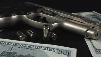 Handgun Bullets and Money Banknotes video