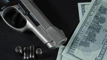 Handgun Bullets and Money Banknotes video