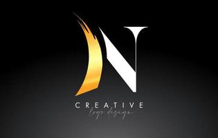 Golden Brush Letter N Logo Design with Creative Artistic Paint Brush Stroke and Modern Look Vector