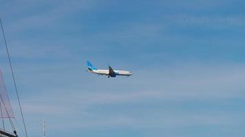 SOCHI, RUSSIAN FEDERATION NOVEMBER 20, 2020 - Pobeda Airliner approaching the airport over the sea. Viewed through the rigging of a sail ship. video