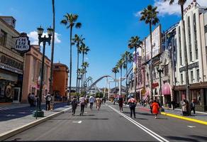 Osaka, Japan on April 9, 2019. This is a rear view photo of people walking into Universal Studios Japan.