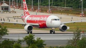 PHUKET, THAILAND DECEMBER 1, 2018 - Airbus A320 airplane of AirAsia airlines turn on runway and ready to start. Air Asia airliner departs from Phuket International airport. video