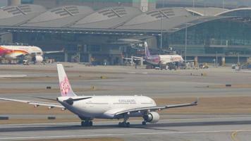 HONG KONG NOVEMBER 10, 2019 - China Airlines accelerates and takes off at Chek Lap Kok International Airport. video