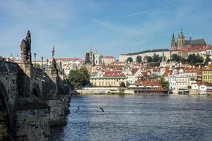 Prague, Czech Republic, 2014. View from Charles Bridge towards the St Vitus Cathedral  in Prague photo