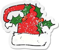 retro distressed sticker of a cartoon christmas holly hat vector