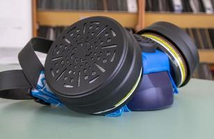 Respirator with interchangeable filter cartridges on the table photo