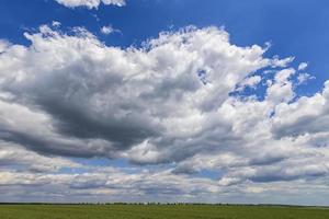 The vast blue sky and clouds. Beautiful wallpaper. Horizontal view photo