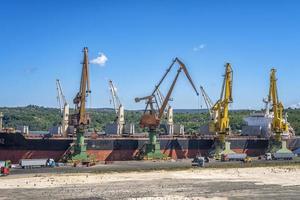 a large ship loading grain for export. Water transport photo