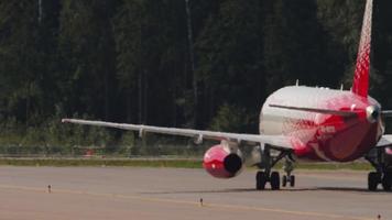 MOSCOW, RUSSIAN FEDERATION JULY 31, 2021 - Footage of Sukhoi Superjet on the airfield. Sukhoi Superjet of Rossiya taxiing at Sheremetyevo Airport SVO. Tourism and travel concept. video