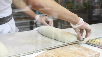 Baker making a delicious stuffed bread video