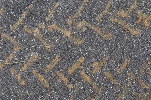 Detailed view on asphalt surfaces of different streets and roads with cracks photo