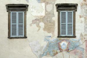Bergamo, Lombardy, Italy, 2014. Old faded mural on a wall in Citta Alta Bergamo