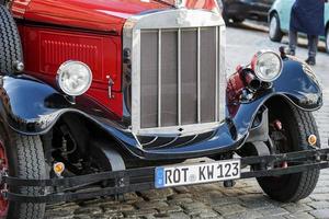 Rothenburg, Germany, 2014. Old fashioned red bus in Rothenburg photo