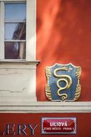 Prague, Czech Republic, 2014. Sign of the Golden Snake on the U Zlateho hada cafe in Prague photo