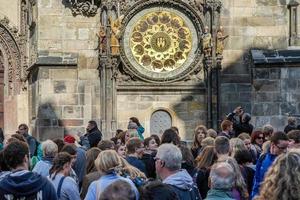 Prague, Czech Republic, 2014. People waiting for the Astronomical Clock in Prague photo