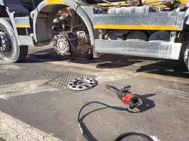 Detail of change wheel on truck, Replacement of new tire photo