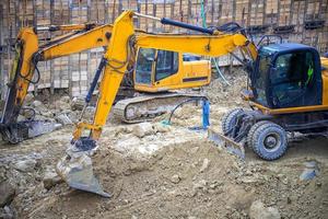 Heavy construction equipment working at the construction site. photo