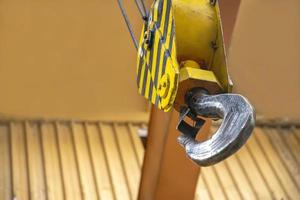 Crane clevis sling hook in an industrial factory. Horizontal view. photo