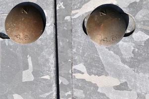 Detailed close up view on metal screws in high resolution. photo