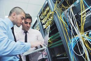 it engineers in network server room photo