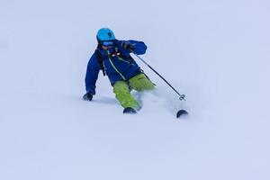 freeride skier skiing downhill photo