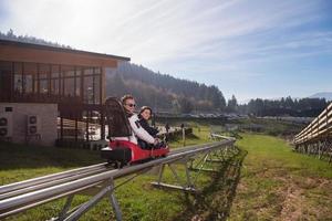 Sweden, 2022 - couple enjoys driving on alpine coaster photo