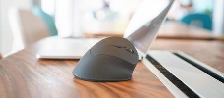 ergonomic mouse on desk at workplace, prevention wrist pain because working long time. De Quervain s tenosynovitis, Intersection Symptom, Carpal Tunnel Syndrome or Office syndrome concept photo