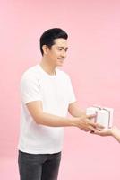 bright picture of handsome man with a gift . photo