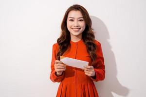 Attractive woman with postcard, on white background photo