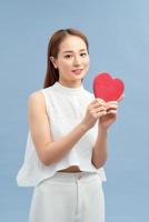 young happy woman hold heart . valentine day concept . photo