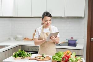Young woman cooking in the kitchen photo