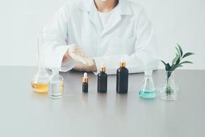 The scientist, dermatologist testing the organic natural cosmetic product in the laboratory. photo