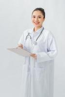 Doctor with a stethoscope, holding a notebook in his hand. photo