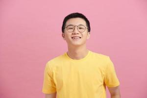 Attractive Asian man with glasses close up portrait photo