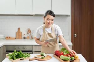 Young woman cooking in the kitchen photo