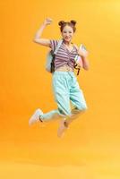 happy student jumping with books photo